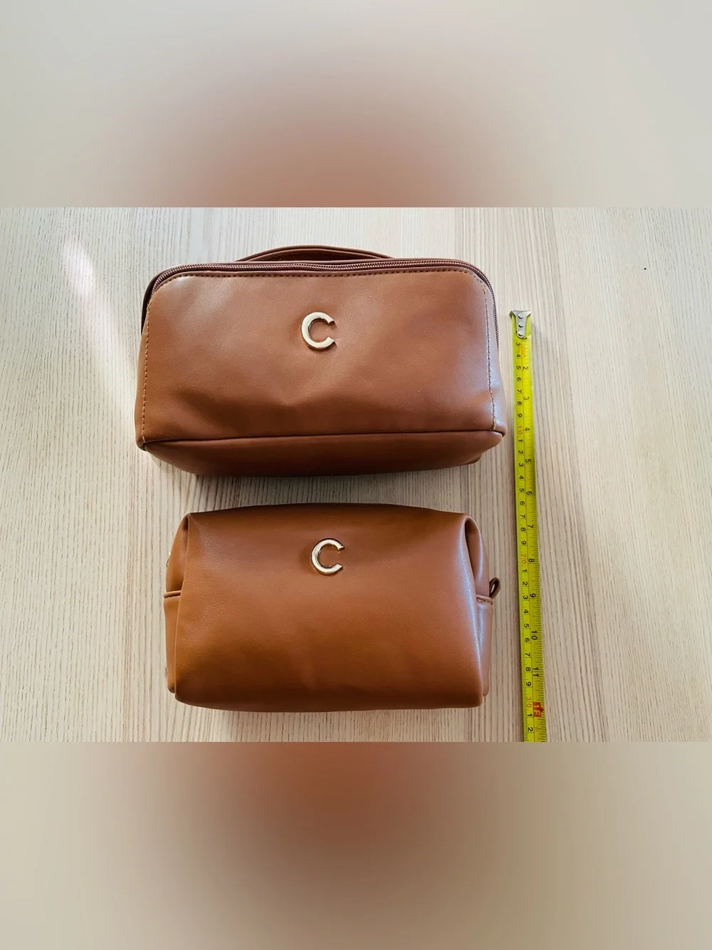 Tan faux leather matching cosmetic bag/ case set, gold “C” emblem, excellent